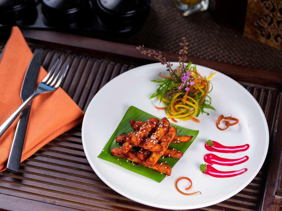 The Orchid Hotel Hinjewadi Pune Exteriör bild A plate of Thai food